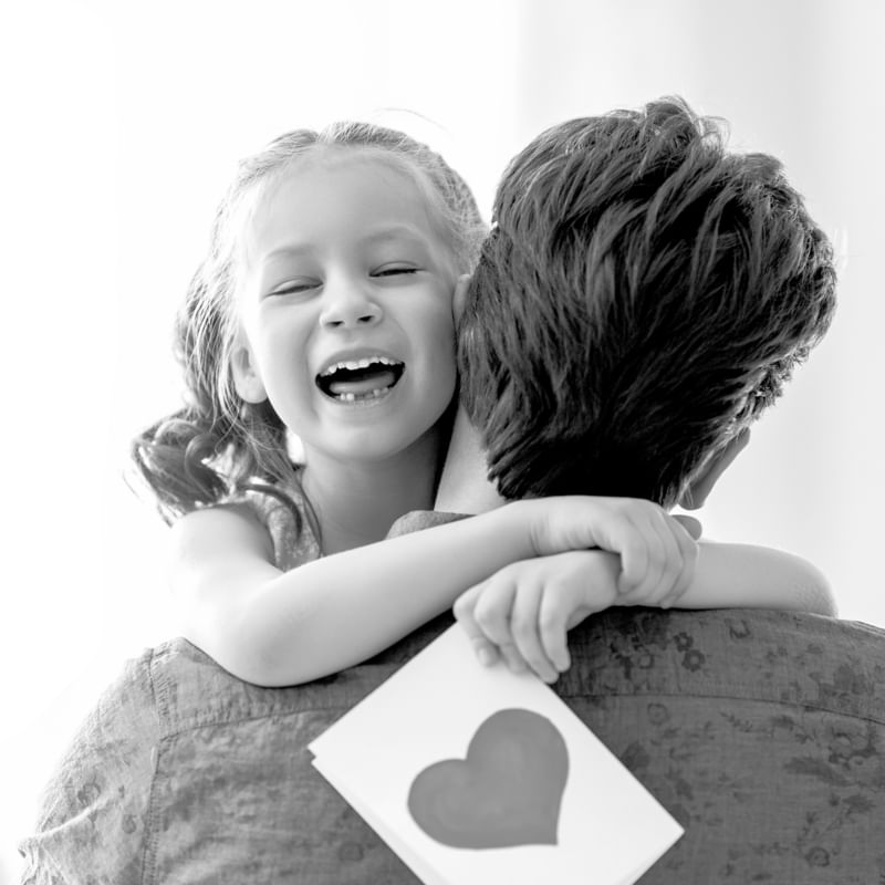 dad holding daughter